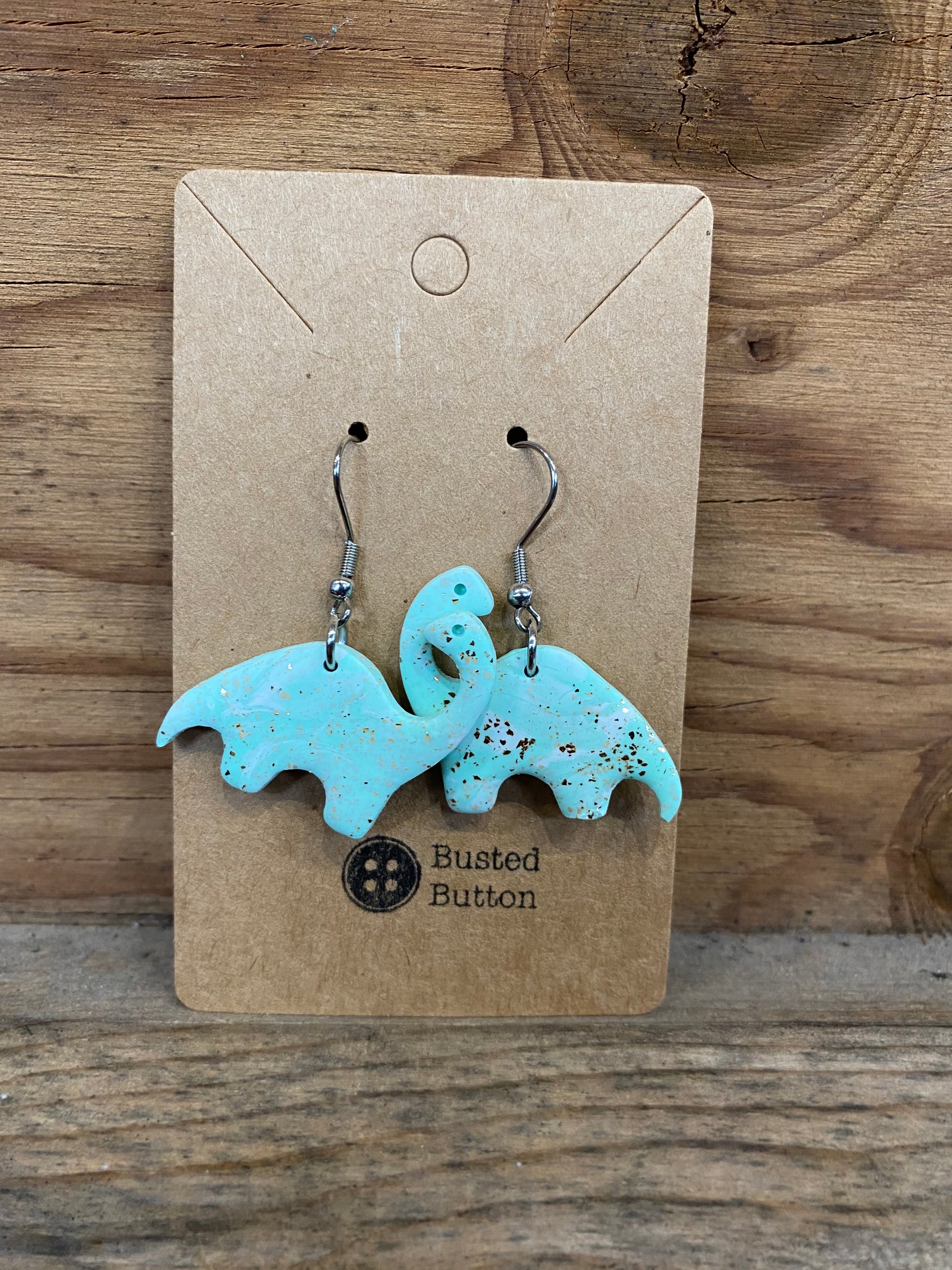 Dangly Brontosaurus earrings (Blue Sparkly)