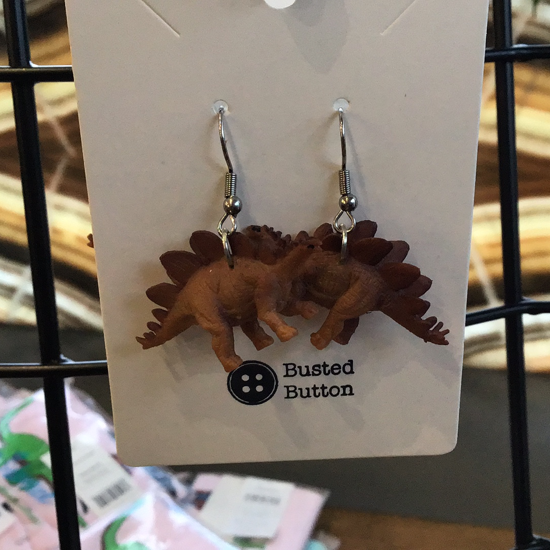 Toy earrings stegosaurus